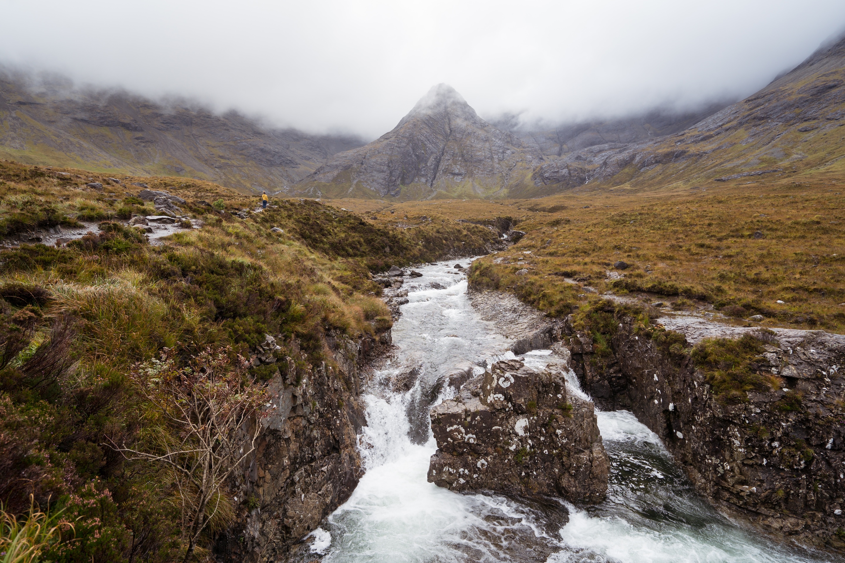 Scenic landscape of mountains under cloudy sky